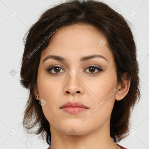 Neutral white young-adult female with long  brown hair and brown eyes