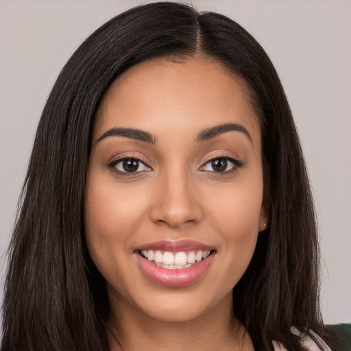 Joyful white young-adult female with long  brown hair and brown eyes