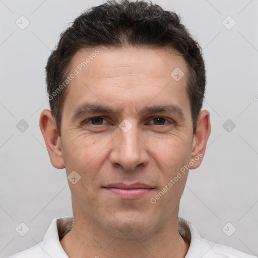 Joyful white adult male with short  brown hair and brown eyes