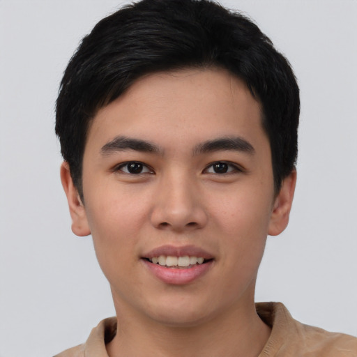 Joyful asian young-adult male with short  black hair and brown eyes