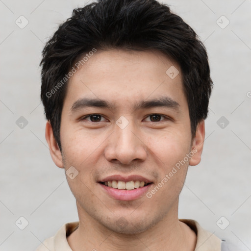 Joyful white young-adult male with short  black hair and brown eyes