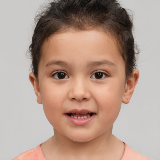 Joyful white child male with short  brown hair and brown eyes