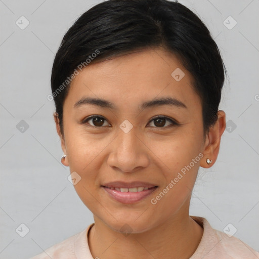 Joyful asian young-adult female with short  black hair and brown eyes