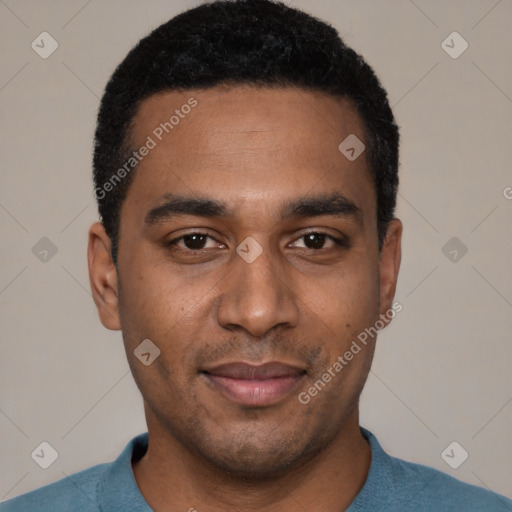 Joyful black young-adult male with short  black hair and brown eyes