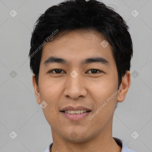 Joyful asian young-adult male with short  black hair and brown eyes