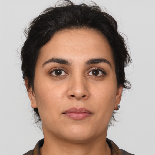 Neutral latino young-adult female with medium  brown hair and brown eyes