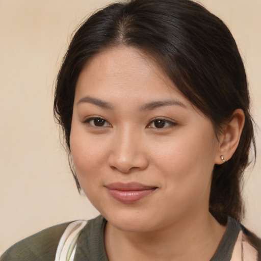 Joyful white young-adult female with medium  brown hair and brown eyes