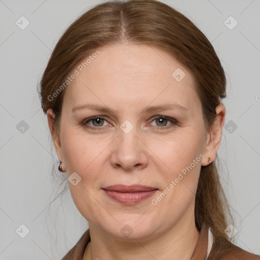 Joyful white adult female with medium  brown hair and grey eyes