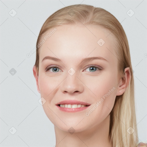 Joyful white young-adult female with long  brown hair and blue eyes