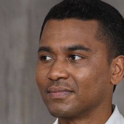 Neutral black young-adult male with short  black hair and brown eyes