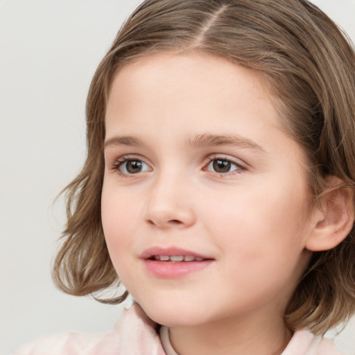 Joyful white child female with medium  brown hair and grey eyes