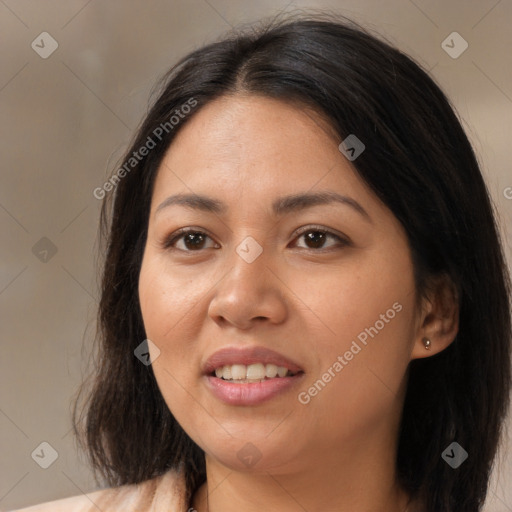 Joyful latino young-adult female with medium  brown hair and brown eyes