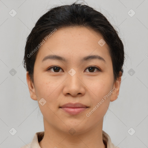 Joyful asian young-adult female with short  brown hair and brown eyes