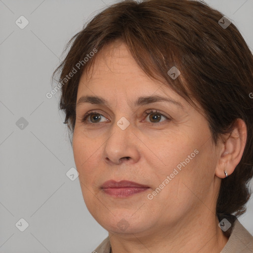 Joyful white adult female with medium  brown hair and brown eyes