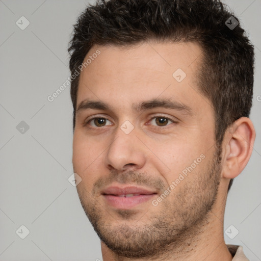 Joyful white young-adult male with short  brown hair and brown eyes