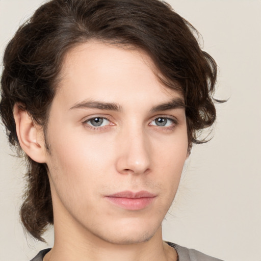 Neutral white young-adult male with medium  brown hair and brown eyes