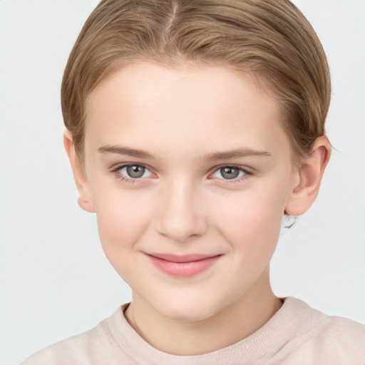 Joyful white child female with short  brown hair and brown eyes