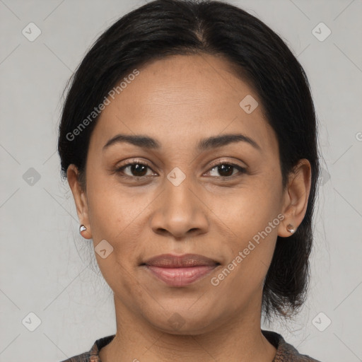 Joyful latino young-adult female with medium  black hair and brown eyes