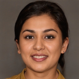 Joyful white young-adult female with medium  brown hair and brown eyes