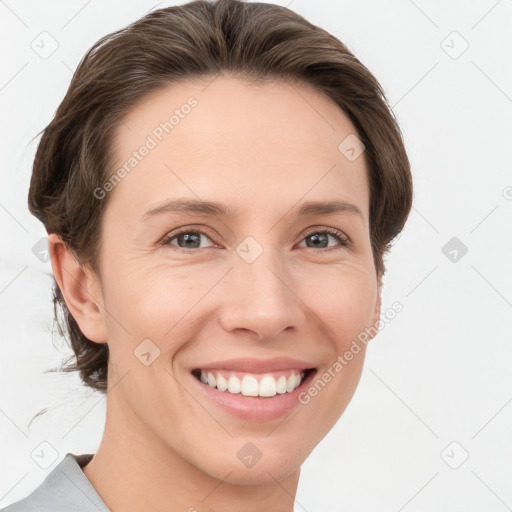 Joyful white young-adult female with short  brown hair and grey eyes