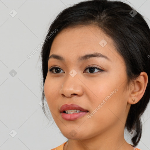 Joyful asian young-adult female with medium  brown hair and brown eyes