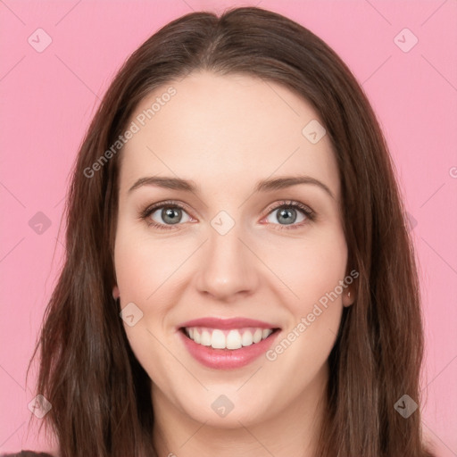 Joyful white young-adult female with long  brown hair and green eyes