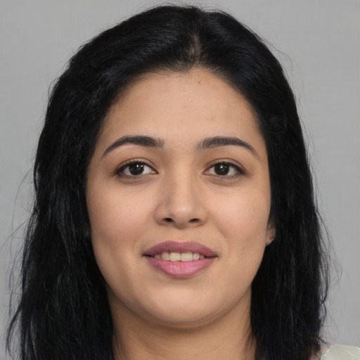 Joyful asian young-adult female with long  black hair and brown eyes
