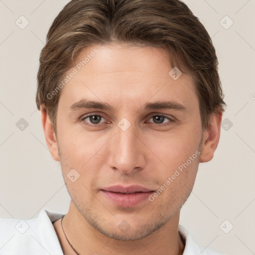 Joyful white young-adult male with short  brown hair and brown eyes