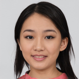 Joyful asian young-adult female with medium  black hair and brown eyes