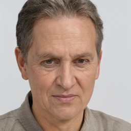 Joyful white middle-aged male with short  brown hair and brown eyes