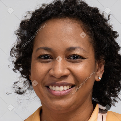 Joyful black young-adult female with medium  brown hair and brown eyes