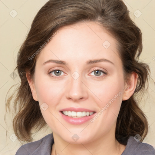 Joyful white young-adult female with medium  brown hair and green eyes