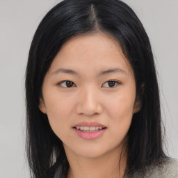 Joyful asian young-adult female with medium  black hair and brown eyes