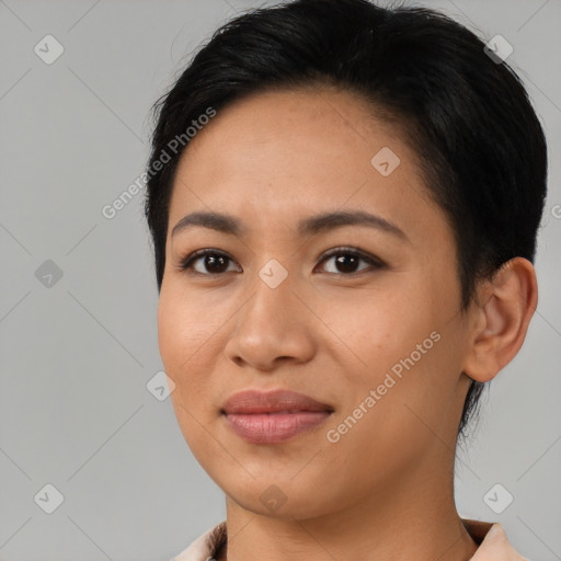 Joyful latino young-adult female with medium  brown hair and brown eyes