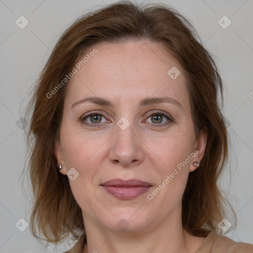 Joyful white adult female with medium  brown hair and grey eyes