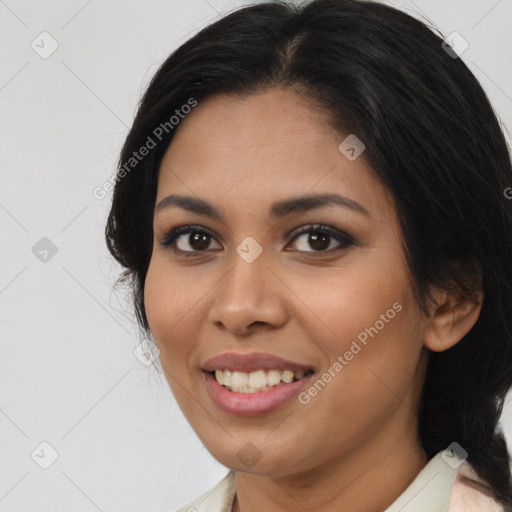 Joyful latino young-adult female with medium  black hair and brown eyes