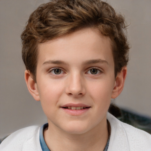 Joyful white child male with short  brown hair and grey eyes