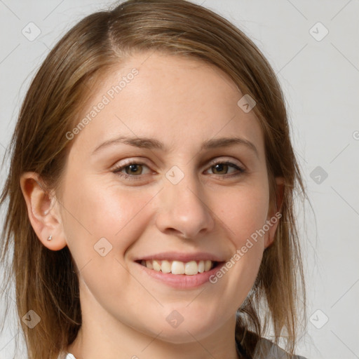 Joyful white young-adult female with medium  brown hair and grey eyes