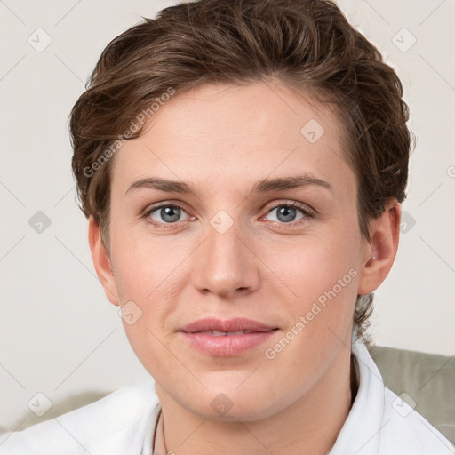 Joyful white young-adult female with short  brown hair and grey eyes