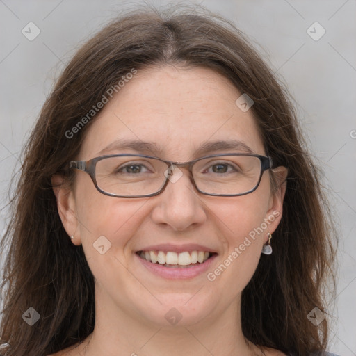 Joyful white adult female with medium  brown hair and grey eyes