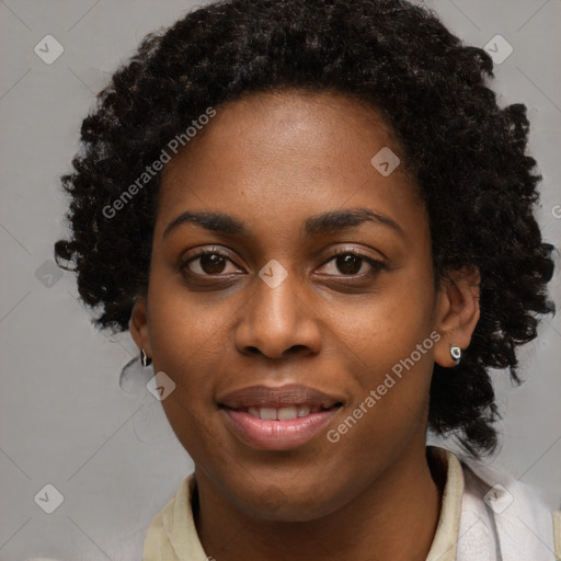 Joyful black young-adult female with long  black hair and brown eyes