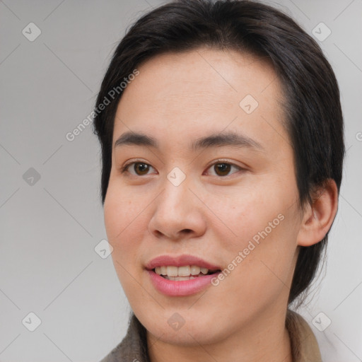 Joyful asian young-adult female with short  brown hair and brown eyes