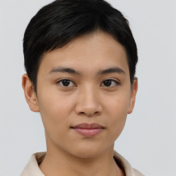 Joyful asian young-adult female with short  brown hair and brown eyes