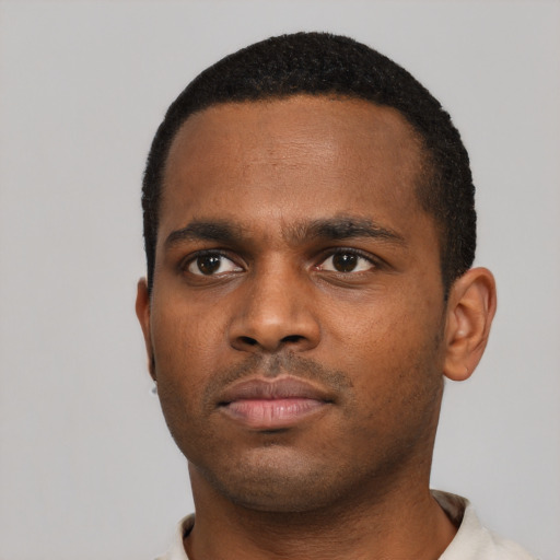Neutral black young-adult male with short  black hair and brown eyes
