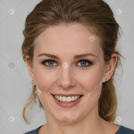 Joyful white young-adult female with medium  brown hair and grey eyes