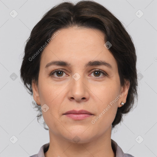 Joyful white adult female with medium  brown hair and brown eyes