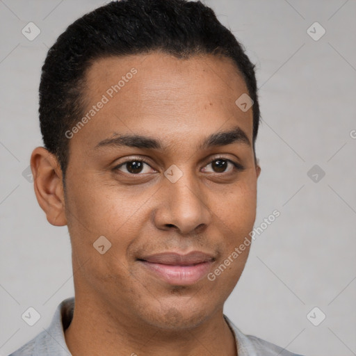 Joyful black young-adult male with short  brown hair and brown eyes