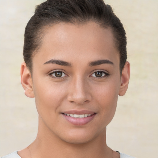 Joyful white young-adult female with short  brown hair and brown eyes