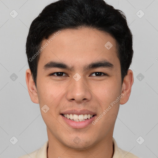 Joyful latino young-adult male with short  brown hair and brown eyes