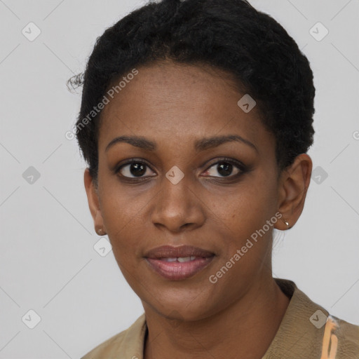 Joyful black young-adult female with short  black hair and brown eyes